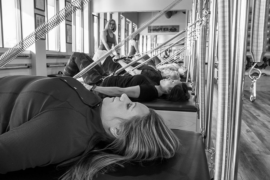 Jlb Pilates Laying On Reformer 211