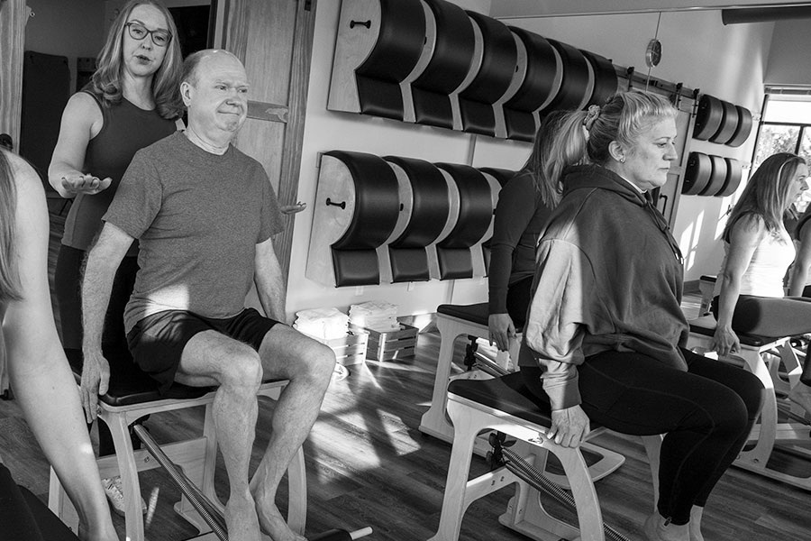 Jlb Pilates Man Sitting On Wunda Chair In Group Class 149